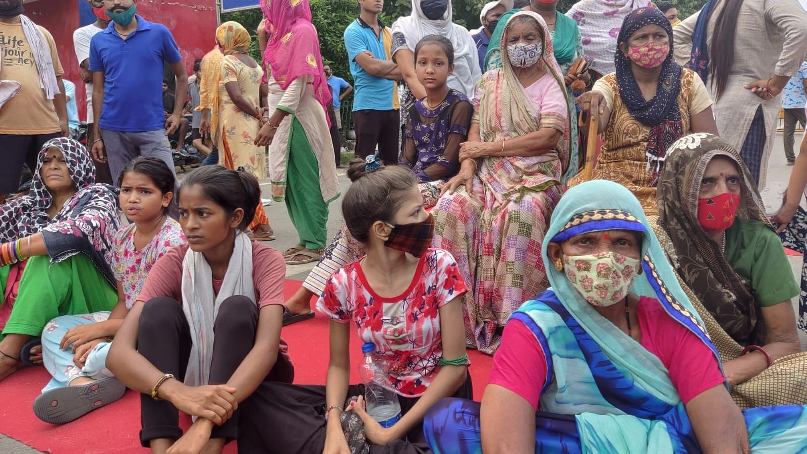 <div class="paragraphs"><p>Women sit in protests in Southwest Delhi in the wake of the death of a nine-year-old girl under mysterious circumstances, and her hurried cremation.</p></div>
