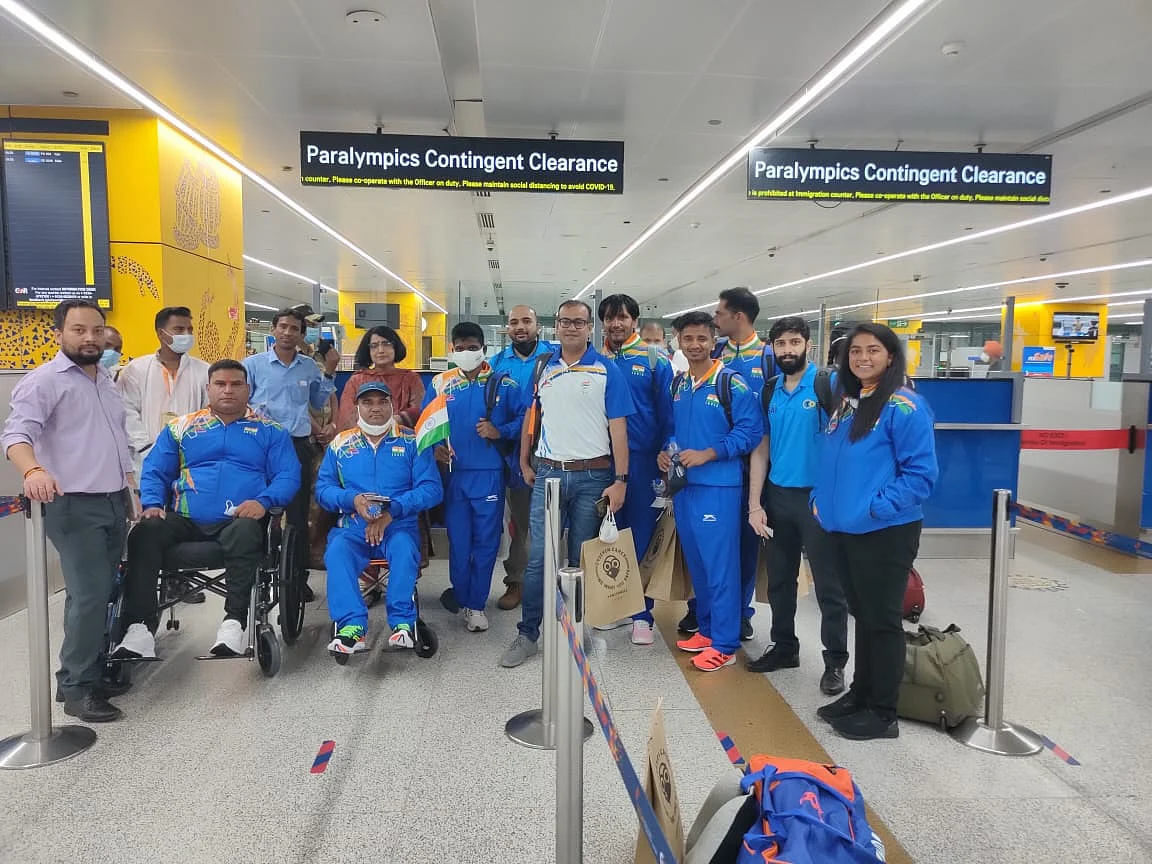 <div class="paragraphs"><p>Indian Paralympians and support staff pose for a photo at the Indira Gandhi International Airport in Delhi early on Wednesday morning. </p></div>
