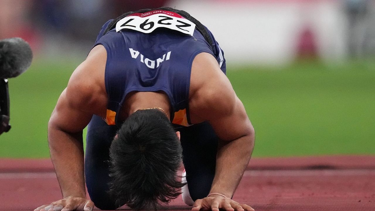 <div class="paragraphs"><p>India's Neeraj Chopra bows down on the track after winning in the finals of the men's javelin throw event at the 2020 Summer Olympics, in Tokyo, Saturday, 7 August, 2021. Chopra became the first to win Athletics Gold for India ever.</p></div>
