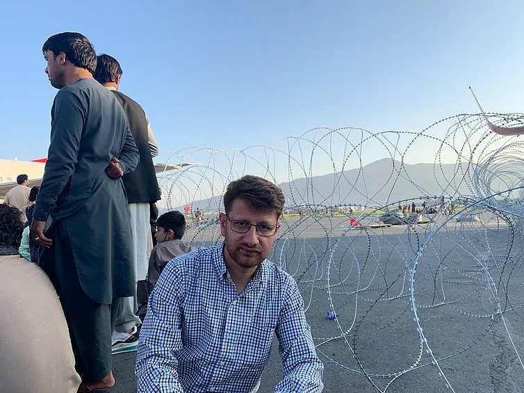 <div class="paragraphs"><p>Sufizada with others trying to leave Afghanistan at Kabul’s Hamid Karzai International Airport. </p></div>