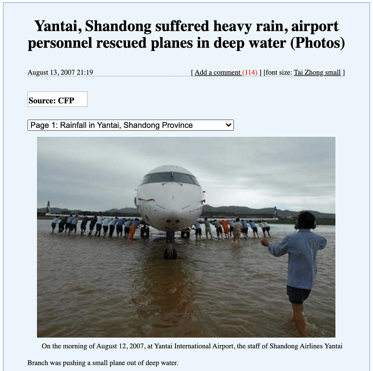 This photo from 2007 shows staff of Shandong Airlines pushing an aircraft at the Yantai airport in China.