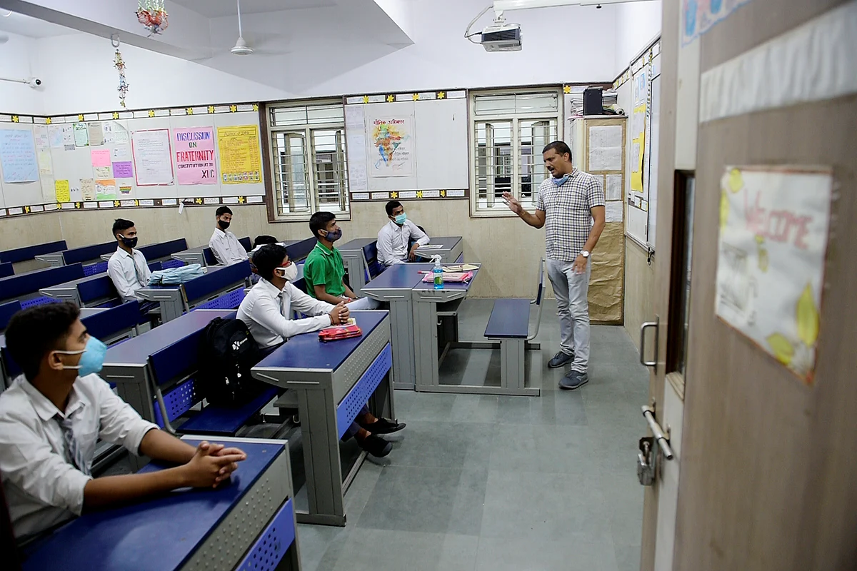 <div class="paragraphs"><p>Students attend a class at the Sarvodaya Bal Vidyalaya, Rouse Avenue which reopened after further ease in COVID-19 restrictions, in New Delhi, Wednesday, 1 September, 2021.</p></div>
