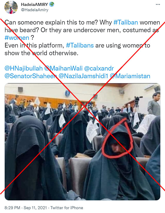 A photograph showing a group of burqa-clad women in a hall was morphed with the face of a man.