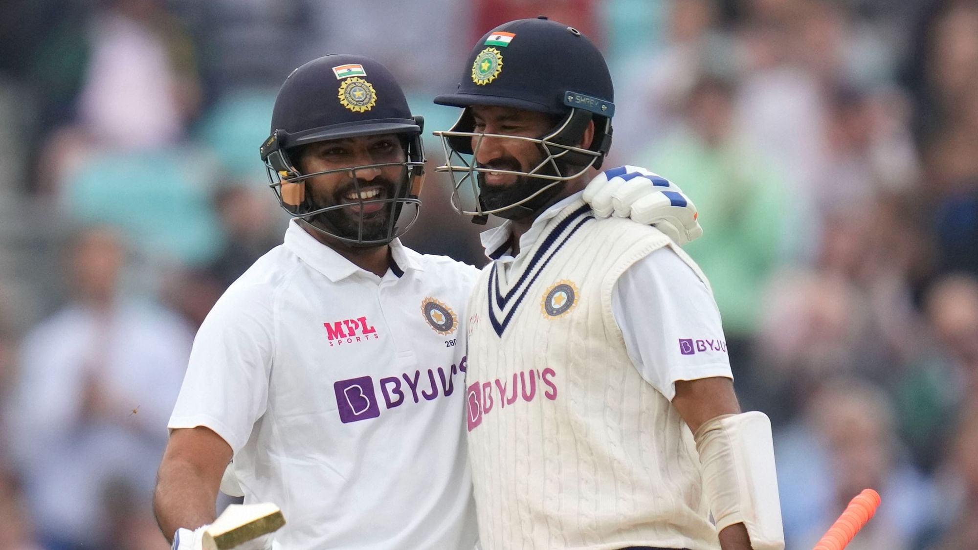 <div class="paragraphs"><p>Rohit Sharma celebrates with Cheteshwar Pujara after scoring his first overseas Test ton at Oval against England.</p></div>
