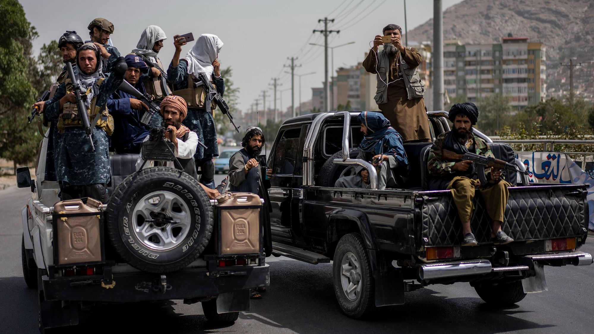 <div class="paragraphs"><p>Taliban fighters escort a women's march in support of the Taliban government outside Kabul University on Saturday, 11 September. </p></div><div class="paragraphs"><p><br></p></div>