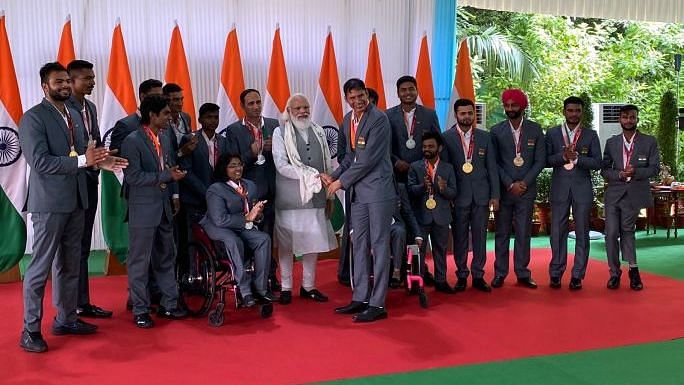 <div class="paragraphs"><p>PM Modi receives a gift from the Indian Tokyo Paralympic contingent.&nbsp;</p></div>