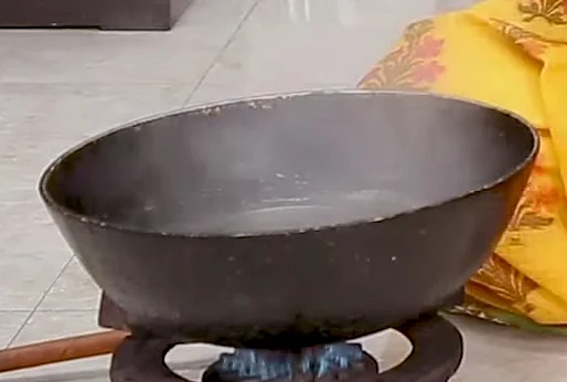 <div class="paragraphs"><p>For making the dhokla, boil some water in a utensil.</p></div>