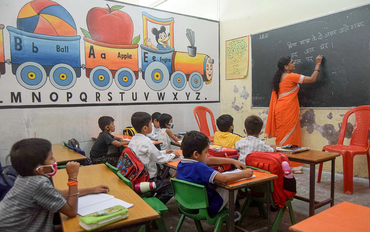 <div class="paragraphs"><p>Students attend a school after it was reopened, in Prayagraj, Wednesday, 1 September, 2021. </p></div>