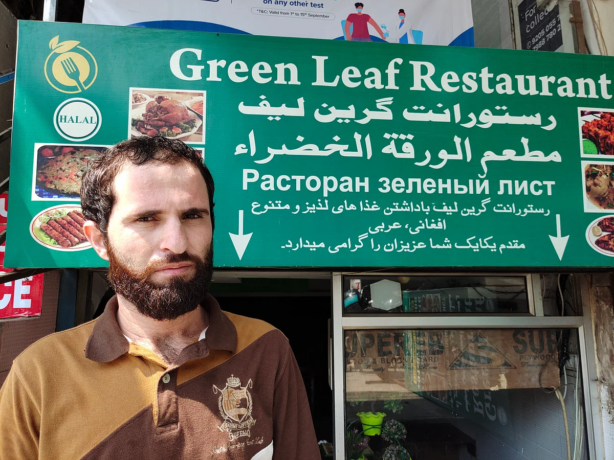 <div class="paragraphs"><p>Sikander Khan (26), Afghan refugee working at Green Leaf Restaurant in Hauz Rani. There are several small eateries selling Afghan food here, employing refugees like Sikander.</p></div>