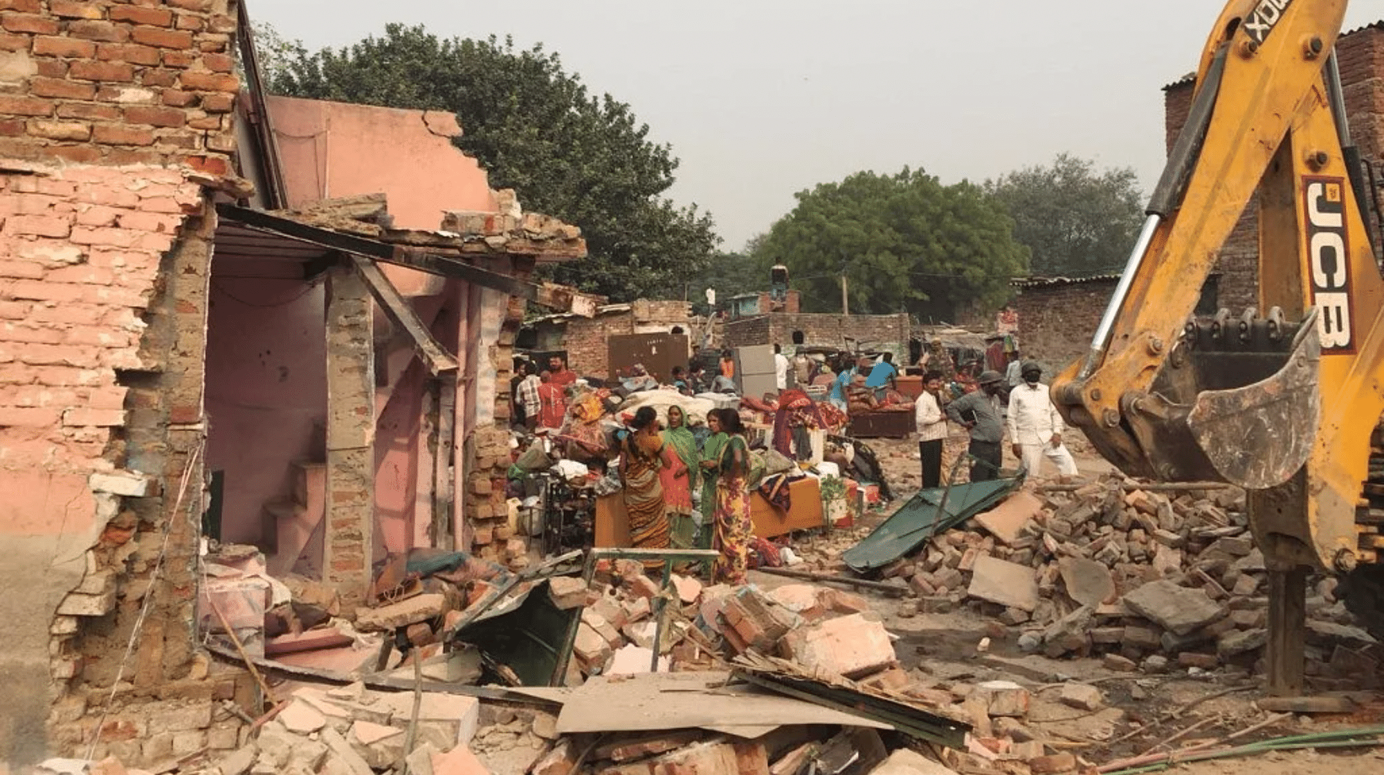 <div class="paragraphs"><p>File photo: Settlers of Kathputli Colony wait where their homes once stood, minutes after they were demolished by the Delhi Development Authority bulldozers on Monday, 30 October.</p></div>