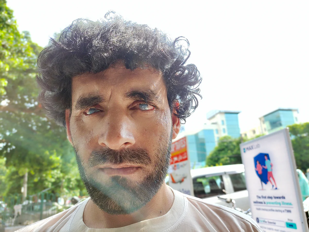 <div class="paragraphs"><p>Nakibullah spends most of his day outside the Max hospital in Delhi's Saket. The hospital building can be seen behind him.</p></div>