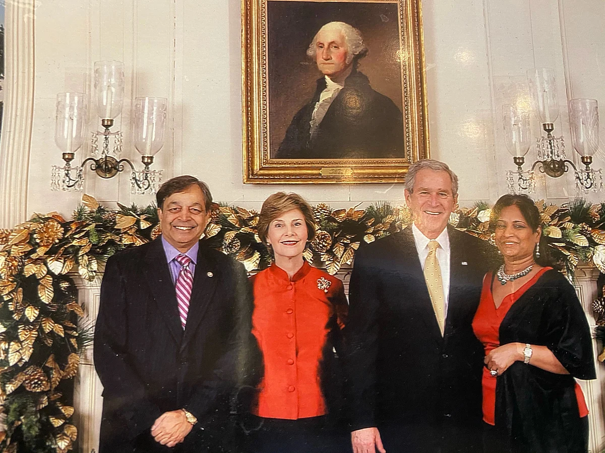<div class="paragraphs"><p>Sampat Shivangi with George W. Bush.</p></div>