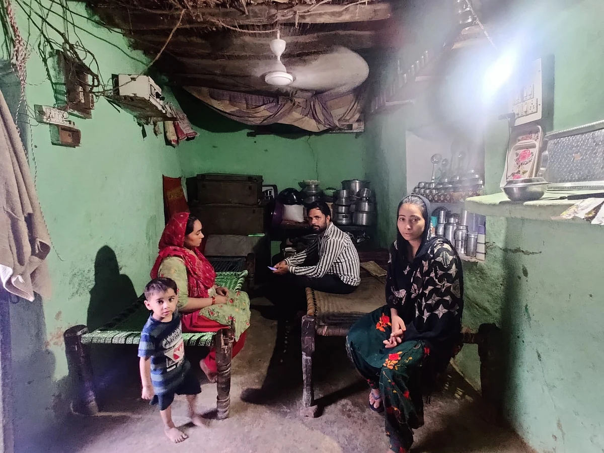 <div class="paragraphs"><p>Shahnawaz's sisters and cousins at their one-room home. They built another home adjacent to this that awaits complete construction. </p></div>
