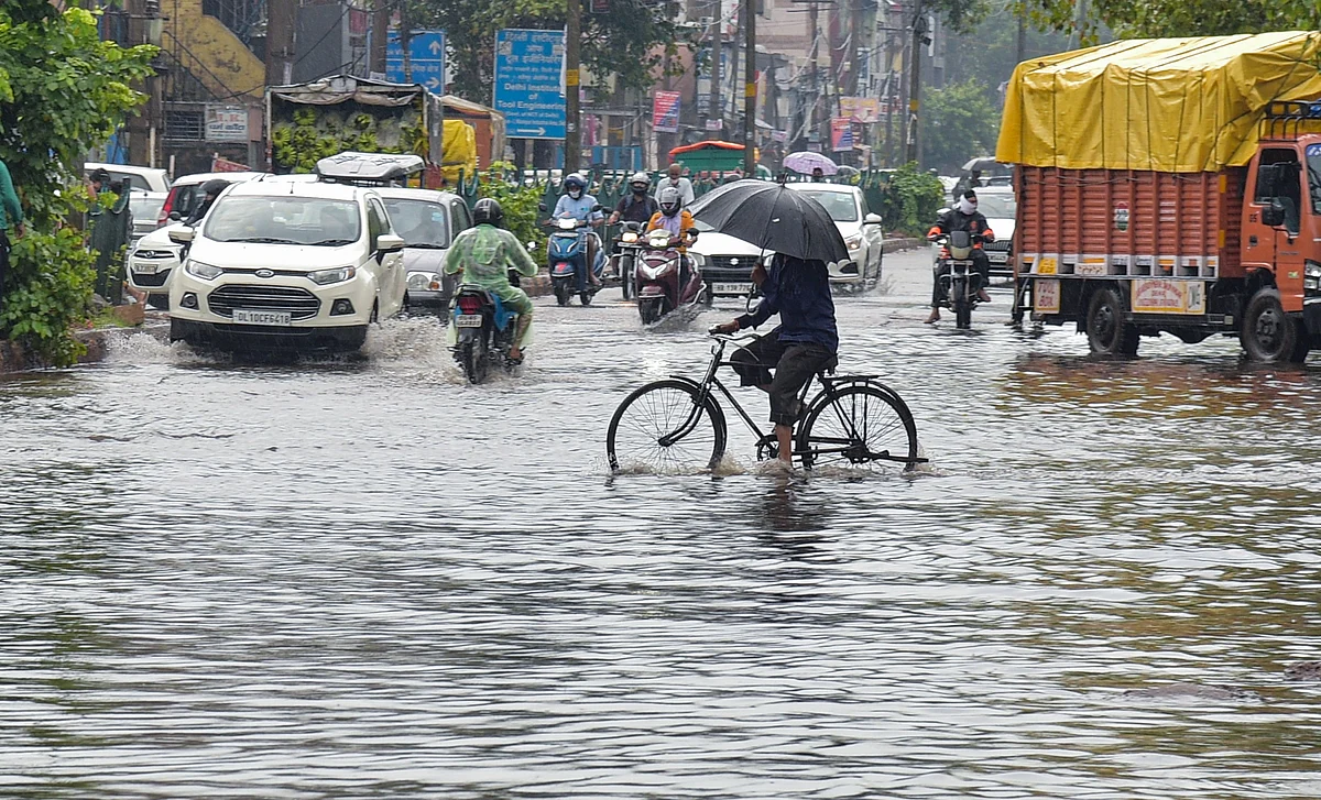 <div class="paragraphs"><p>New Delhi: Commuters wade through the waterlogged Ashok Vihar area after heavy rain in New Delhi, Wednesday, Sept. 1, 2021. Delhi on Wednesday recorded its highest rainfall in at least 12 years. </p></div>