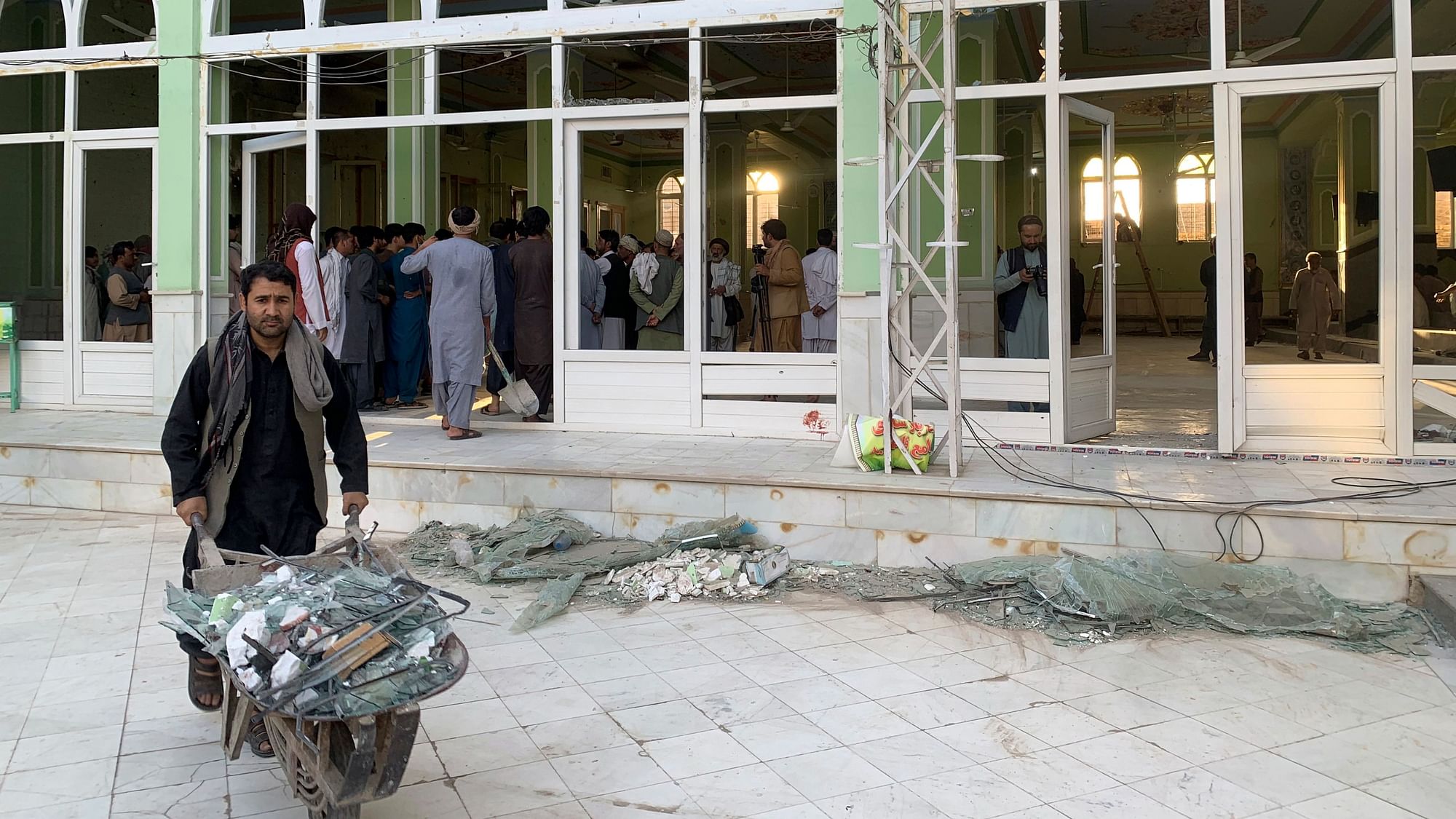 <div class="paragraphs"><p> People view the damage inside of a mosque following a suicide bombers attack in the city of Kandahar, southwest Afghanistan, Friday, 15 October.</p></div>