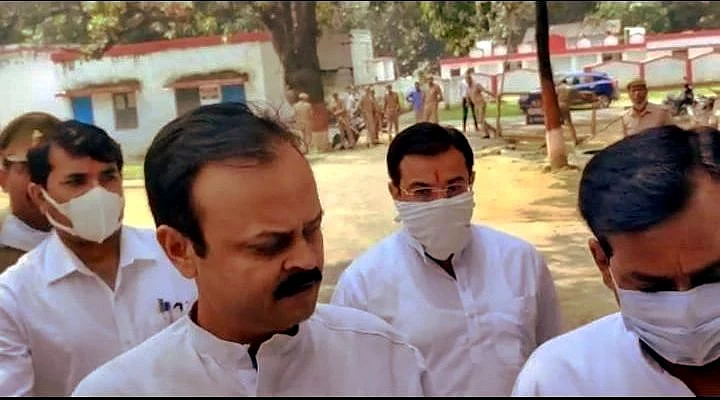 <div class="paragraphs"><p>Ashish Misra (centre), along with his lawyer, arrives at Police Lines to record his statement. </p></div>