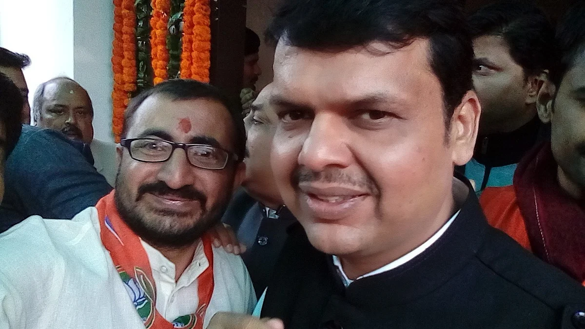 <div class="paragraphs"><p>Bhanushali with Devendra Fadnavis, shared with the media.</p></div>