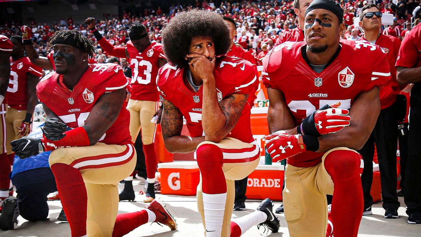 <div class="paragraphs"><p>Colin Kaepernick (center) with Eli Harold (left) and Eric Reid (right) kneel during the national anthem before their NFL game in 2016.&nbsp;&nbsp;</p></div>