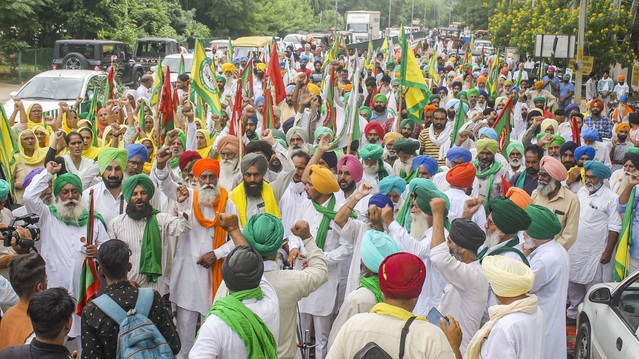<div class="paragraphs"><p>Farm leaders and farmers stage a protest over violence in Lakhimpur Kheri on Sunday, in Patiala.</p></div>