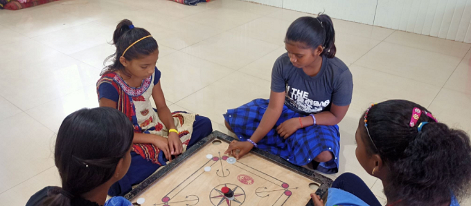 <div class="paragraphs"><p><em>Palo playing carrom with her friends.</em></p></div>