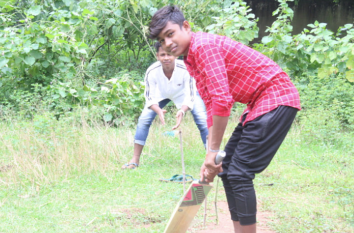 <div class="paragraphs"><p><em>Sanjay Munda playing cricket, his favourite sport, at a residential hostel.</em></p></div>