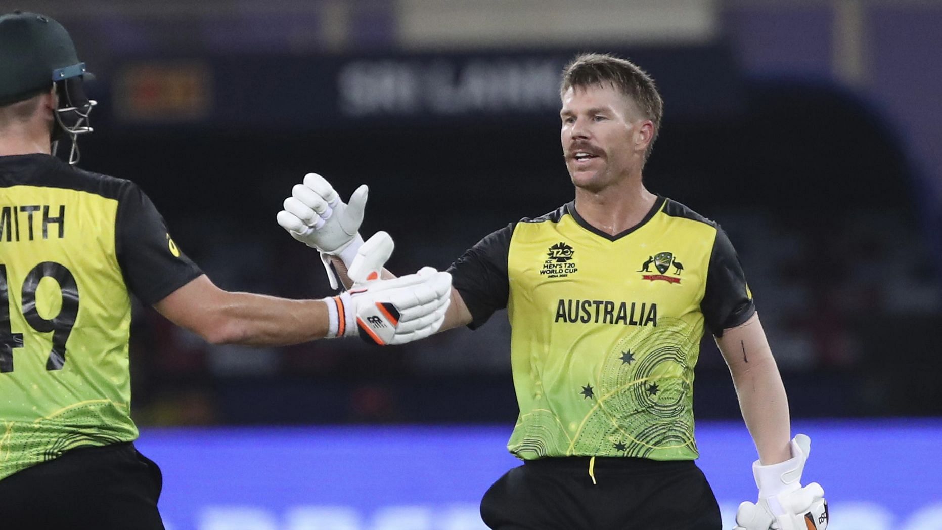 <div class="paragraphs"><p>Australia's David Warner celebrates his fifty  with his teammate Steven Smith during the T20 World Cup match against Sri Lanka.</p></div>