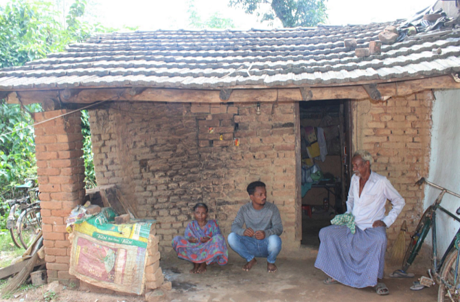 <div class="paragraphs"><p><em>Bikash's grandparents and a teacher in front of his house</em></p><p><br></p></div>