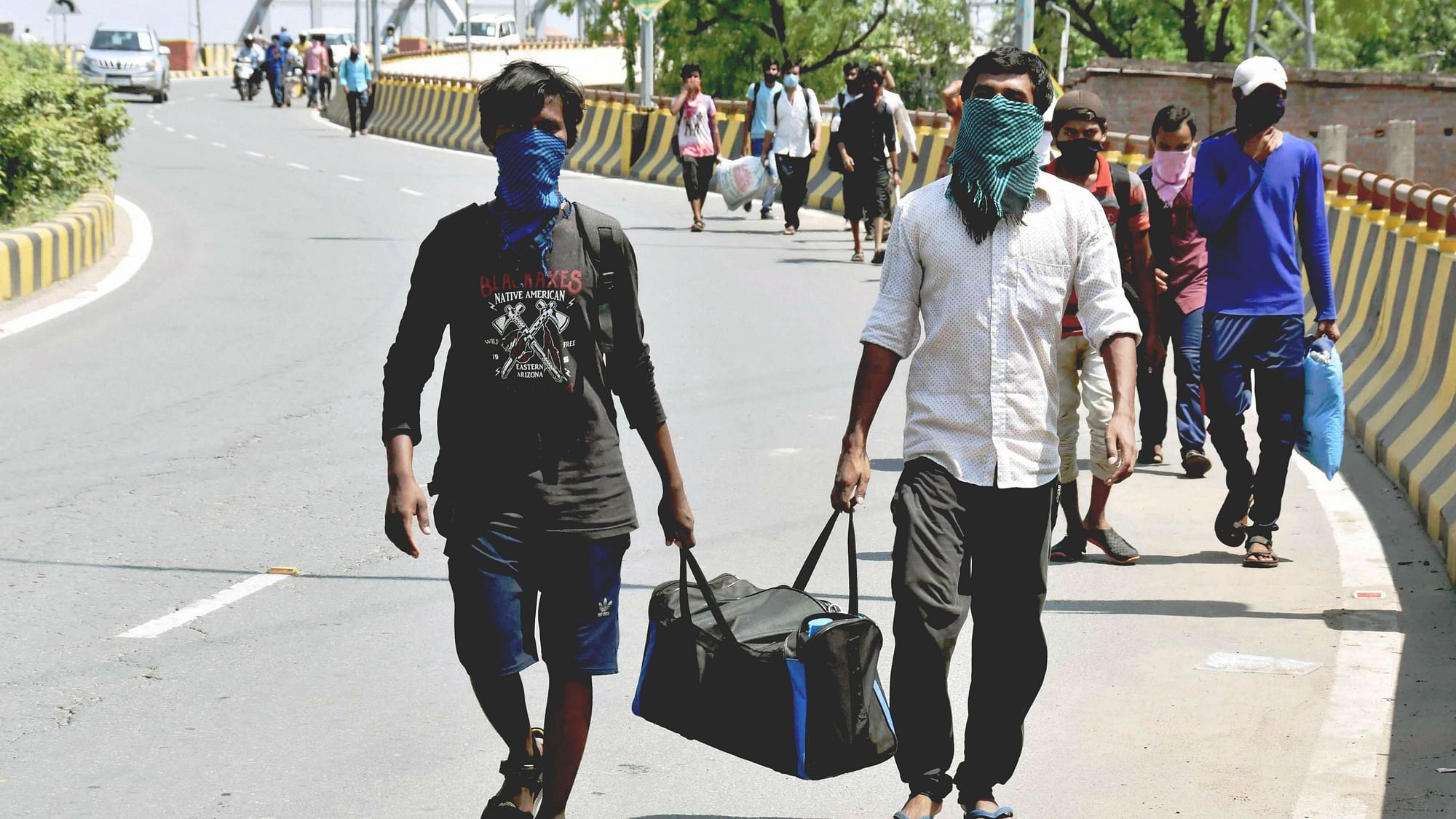 <div class="paragraphs"><p>Migrant workers, arriving from various parts of the country, walk to their native places, amid COVID-19 lockdown in Patna, in May 2020.</p></div>