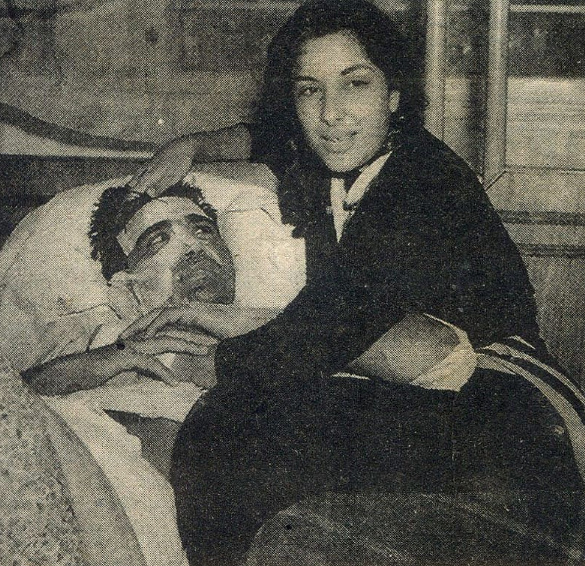 <div class="paragraphs"><p>Nargis with an injured Sunil Dutt.</p></div>