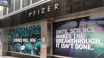 <div class="paragraphs"><p>The world headquarters of Pfizer in New York sports a sign on its window proclaiming the victory of science over COVID-19. The pharmaceutical company made the first COVID-19 vaccine to be approved by western nations. </p></div>