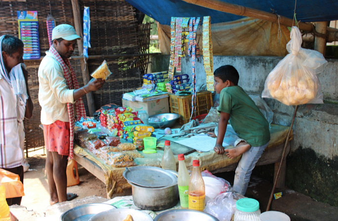 <div class="paragraphs"><p><em>Bikash dealing with a customer.</em></p></div>