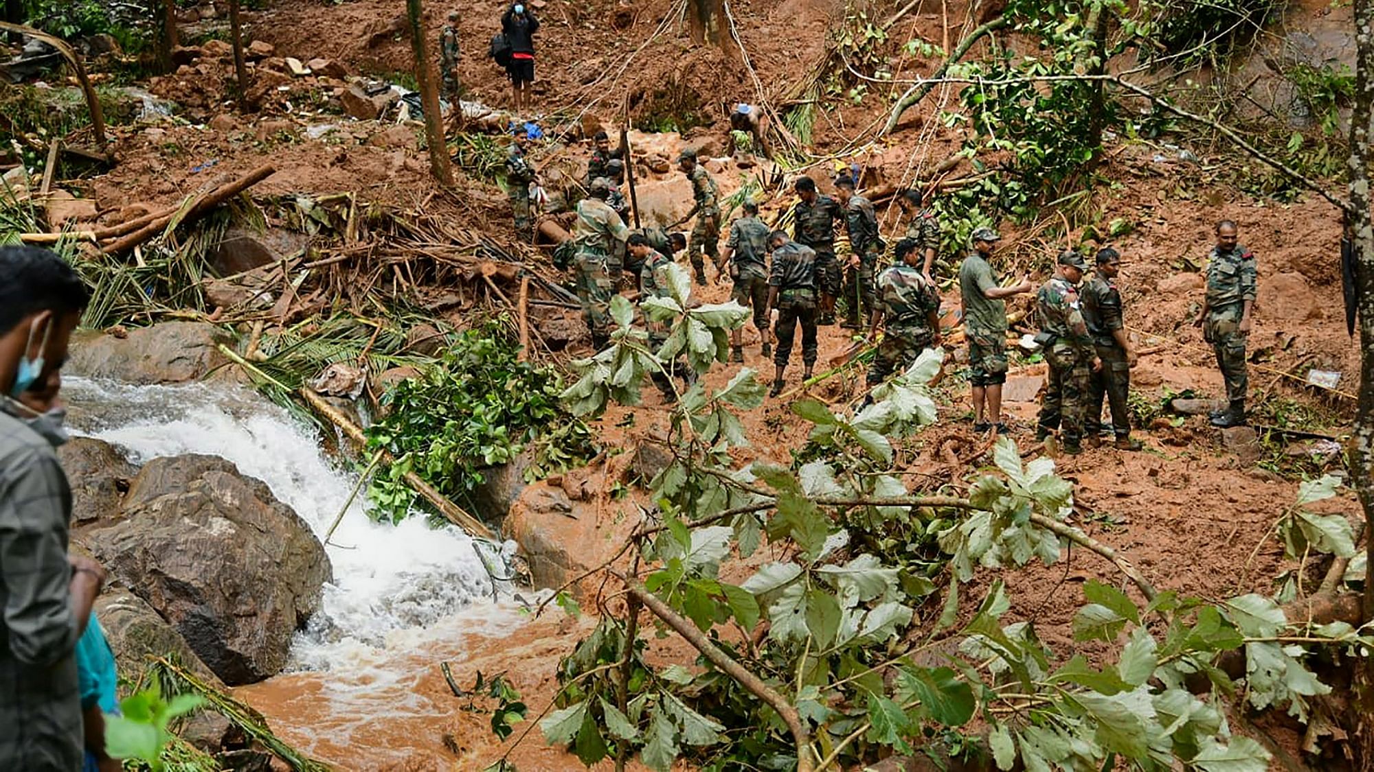 <div class="paragraphs"><p>Kottayam: Rapid Action Force (RAF) and Kerala Fire and Rescue personnel during rescue operations at the site of landslide at Kavali in Kottayam district, Sunday, Oct 17, 2021<br></p></div>