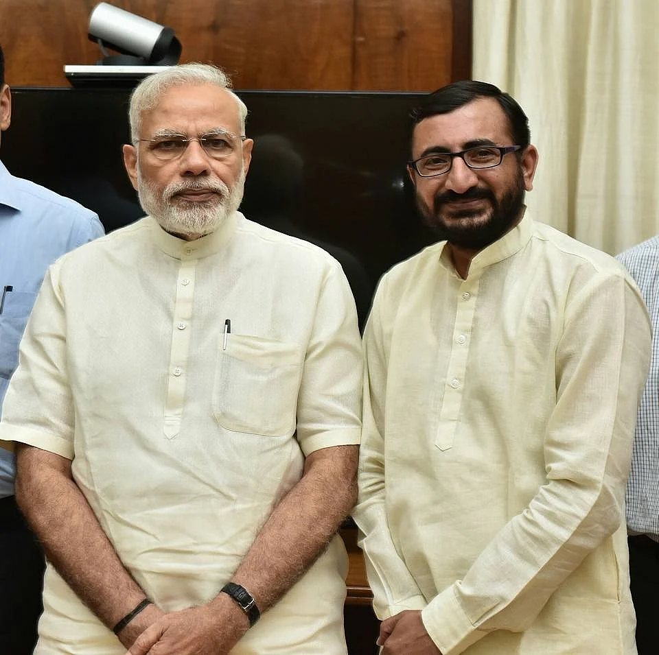 <div class="paragraphs"><p>During the presser, Malik shared photos of Bhanushali with PM Narendra Modi.</p></div>