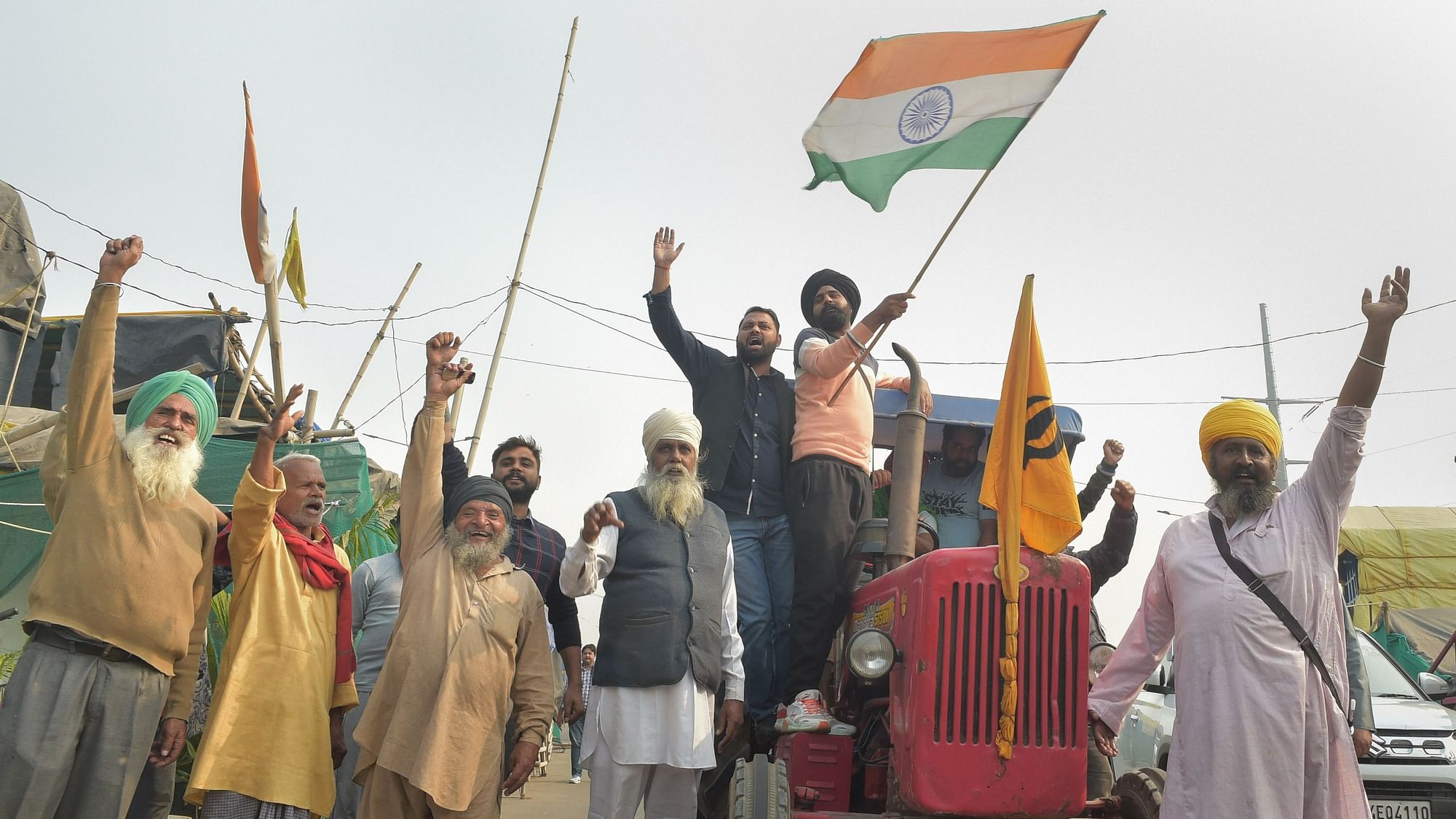 <div class="paragraphs"><p>Farmers celebrate after Prime Minister Narendra Modi announced for the repealing of the three farm reform laws, at Ghazipur border, in New Delhi.</p></div>