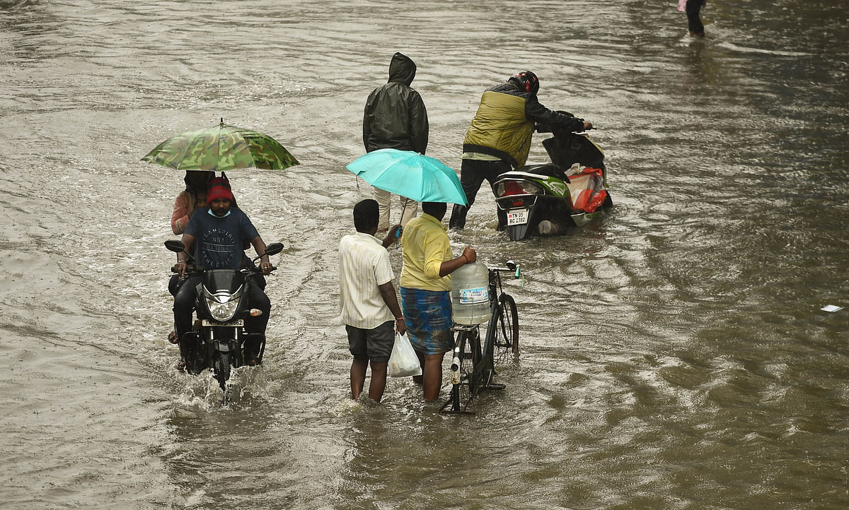 Visuals from Tamil Nadu show people wading through knee-deep water, and even using boats for transit.