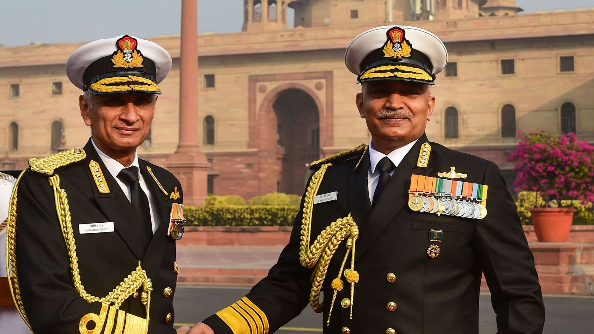 <div class="paragraphs"><p>The newly appointed Naval Chief Admiral R Hari Kumar (Right) being welcomed by the outgoing Naval Chief Admiral Karambir Singh (Left) at South Block, in New Delhi, Tuesday, 30 November.</p></div>