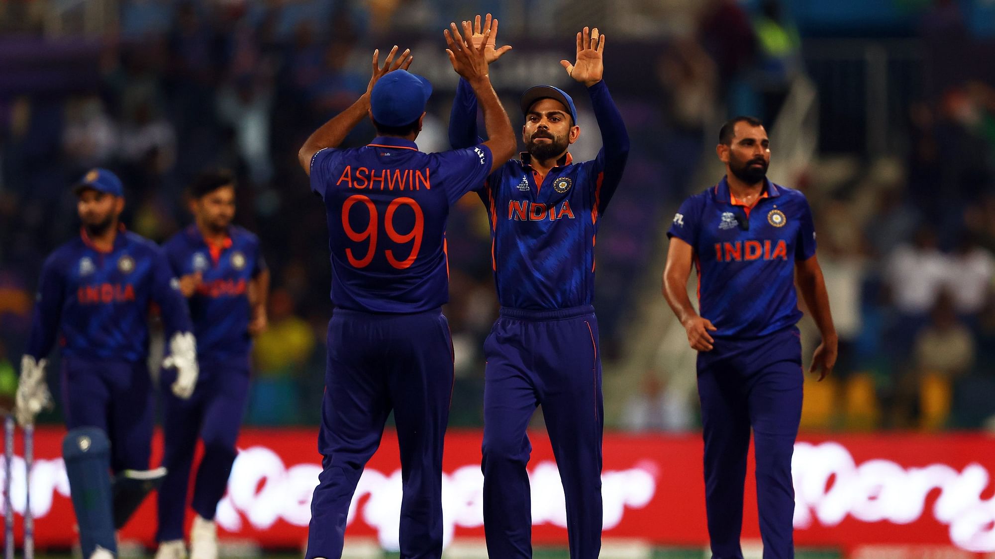 <div class="paragraphs"><p>Virat Kohli and R Ashwin celebrate a wicket against Afghanistan in the 2021 T20 World Cup.</p></div>