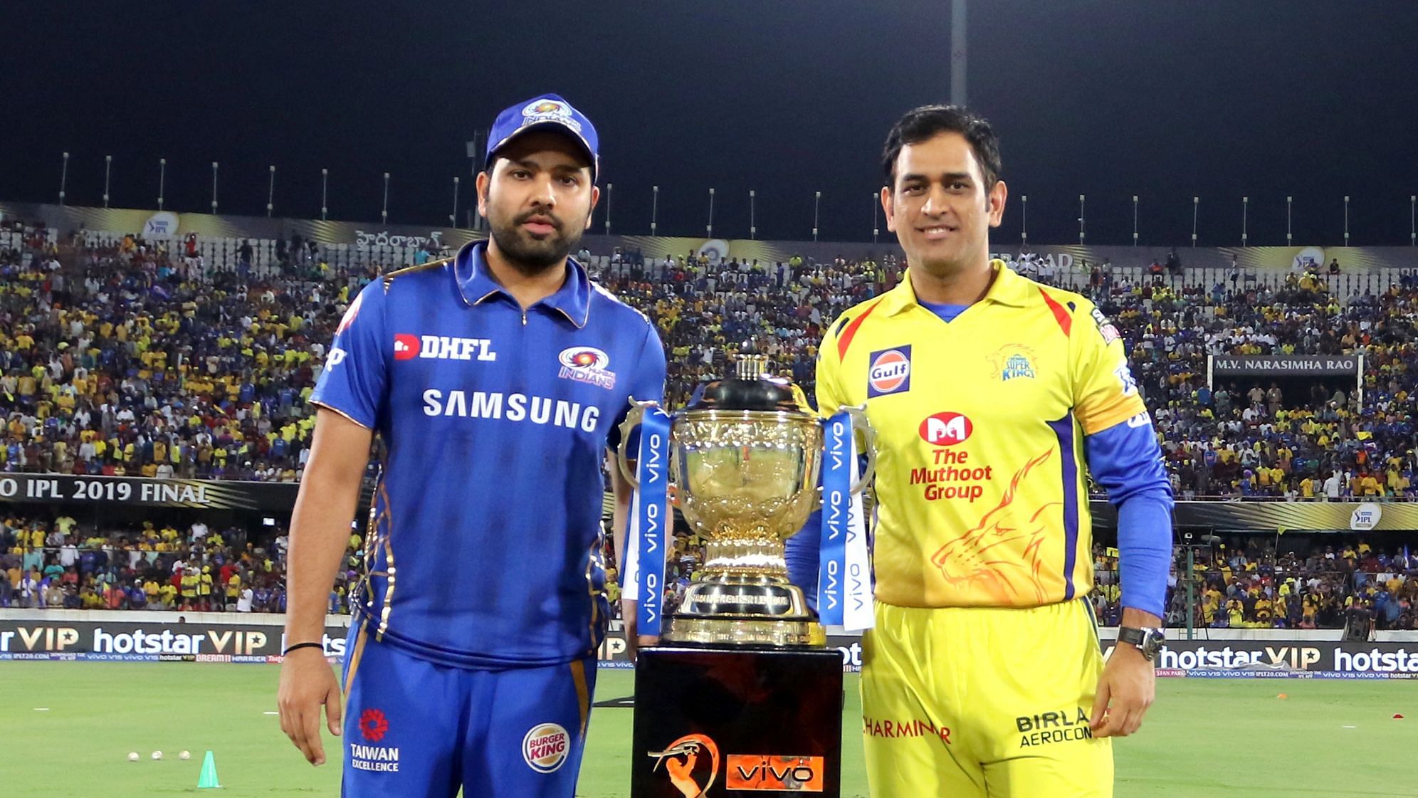 <div class="paragraphs"><p>Rohit Sharma and MS Dhoni pose with the IPL trophy</p></div>