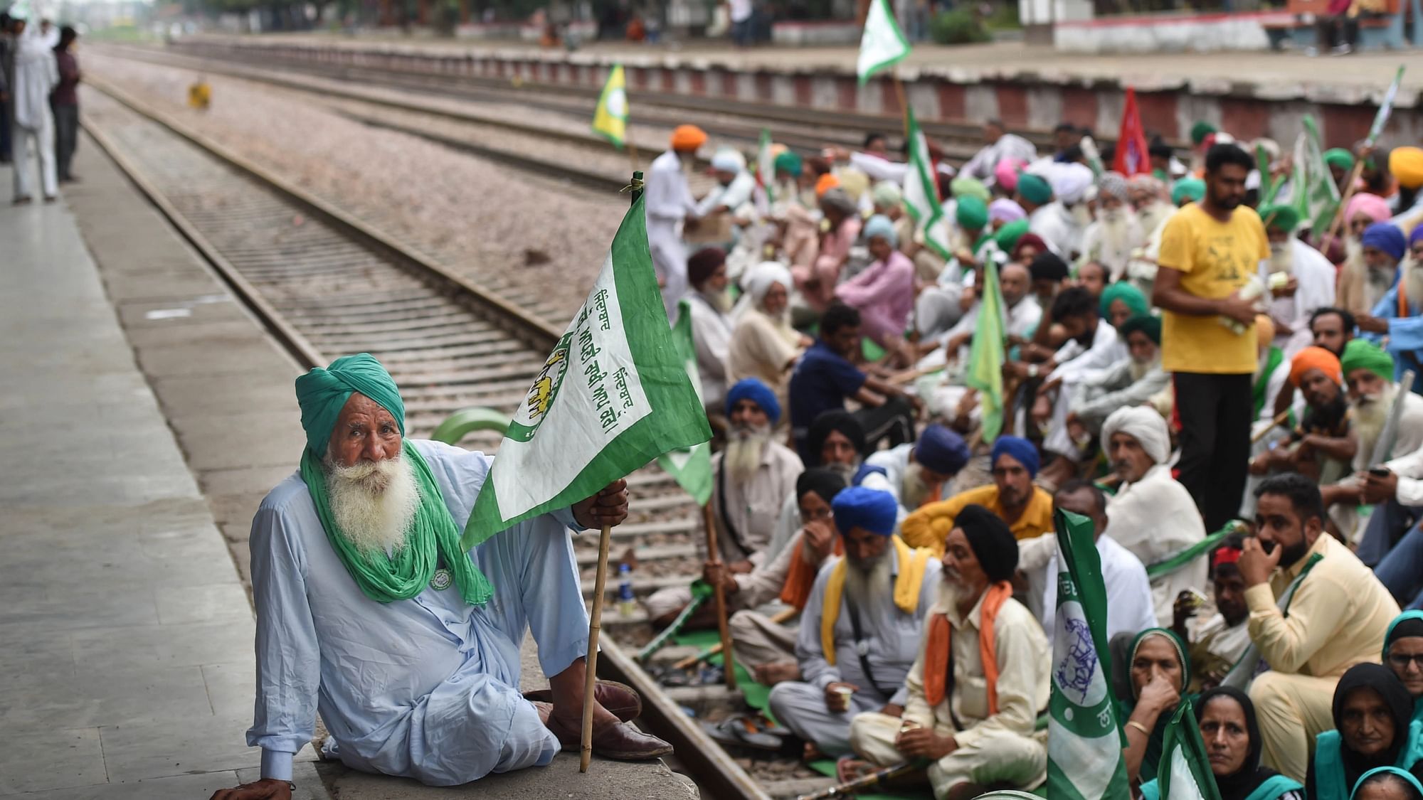 <div class="paragraphs"><p>Farmers block railway tracks as part of the Samyukt Kisan Morchas Rail Roko protest demanding the dismissal and arrest of Union Minister Ajay Mishra in connection with the Oct. 3 violence in Lakhimpur Kheri, in Bahadurgarh, Monday, Oct. 18, 2021.</p></div>
