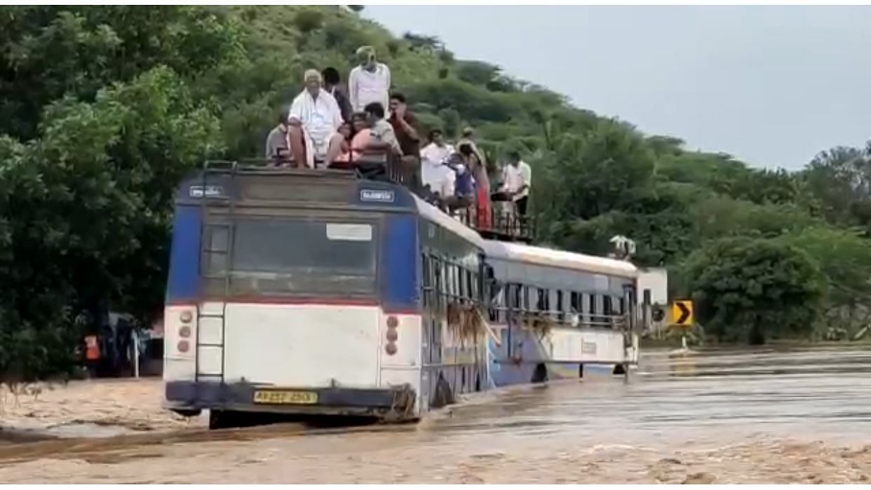 <div class="paragraphs"><p>Passengers of an APSRTC bus stranded in heavy rains and flash floods in Kadapa district.</p></div>