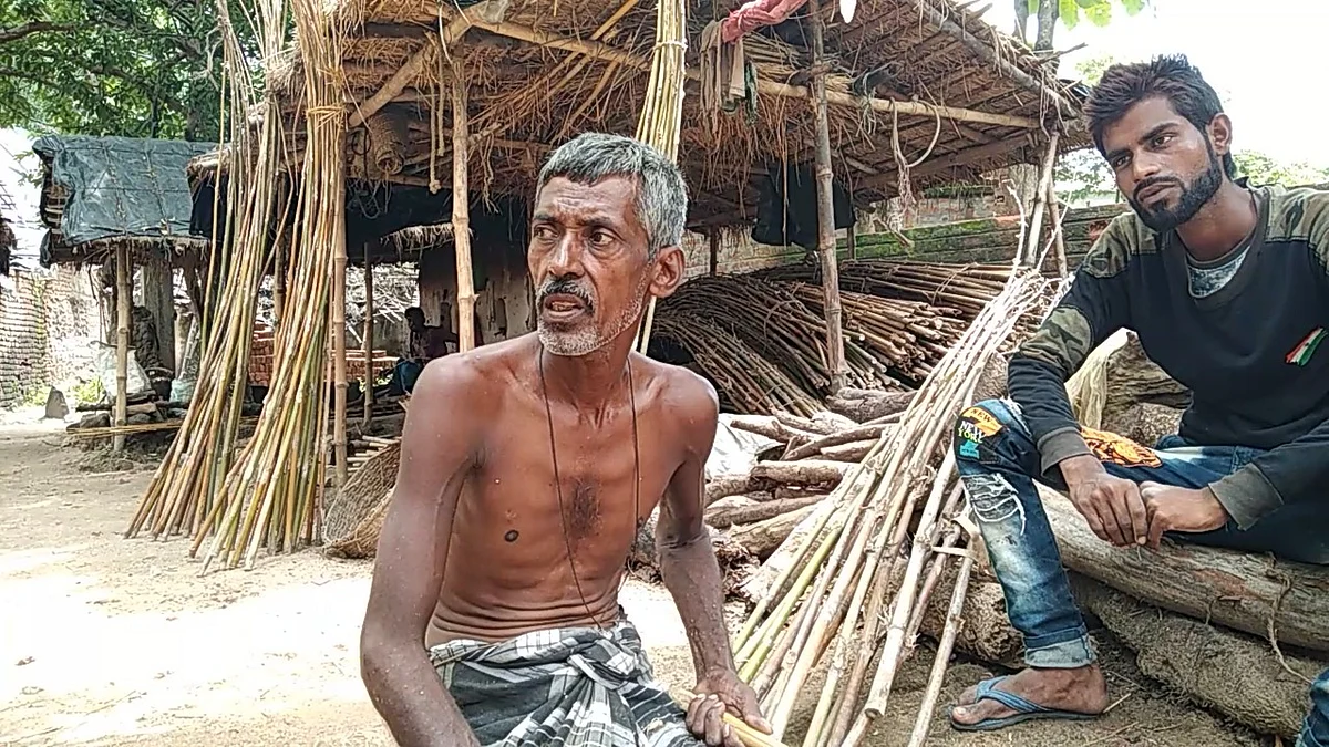 <div class="paragraphs"><p>An artisan with his stored stock of bamboo</p></div>