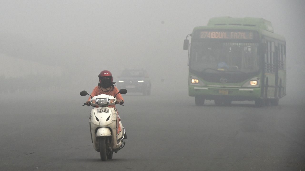 <div class="paragraphs"><p>Vehicles ply amid low visibility due to a thick layer of smog, a day after Diwali celebrations in New Delhi on 5 November.</p></div>