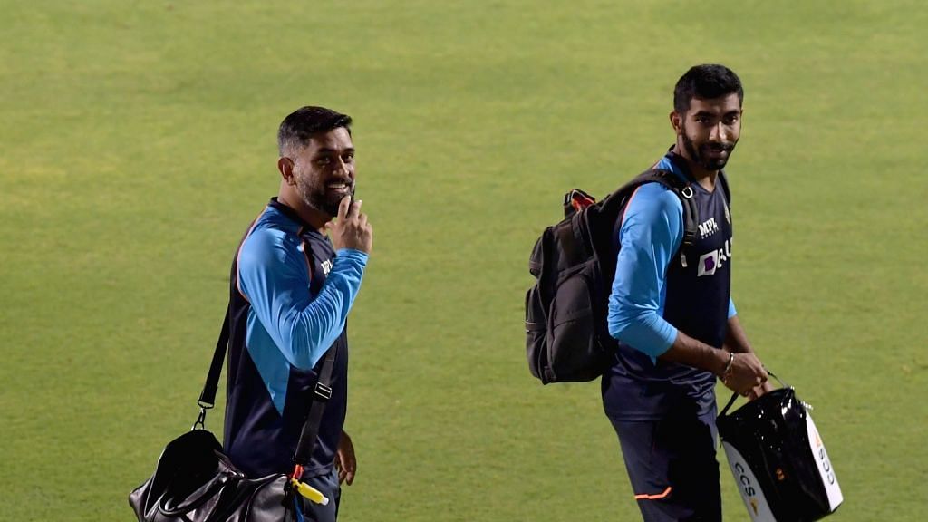 <div class="paragraphs"><p>Jasprit Bumrah and MS Dhoni after a training session.</p></div>