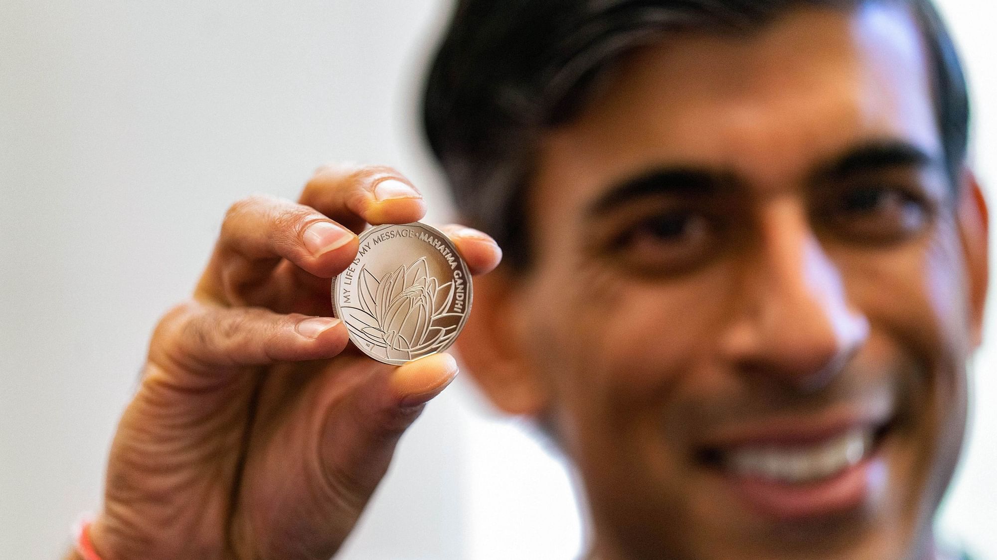 <div class="paragraphs"><p>UK Chancellor Rishi Sunak unveils new commemorative Mahatma Gandhi coin in London, Thursday, 4 November.</p></div>