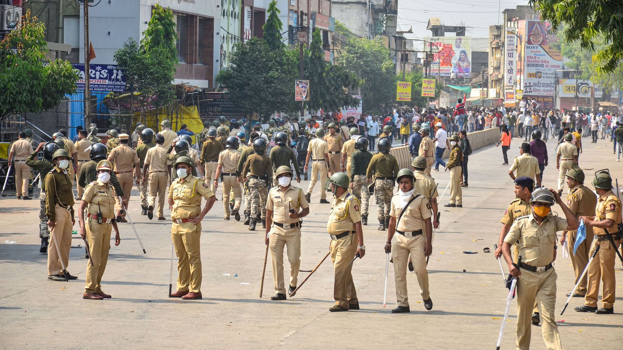 <div class="paragraphs"><p>Policemen use tear gas to disperse protesters after Amravati bandh turns violent, on Saturday, 13 November.&nbsp;</p></div>