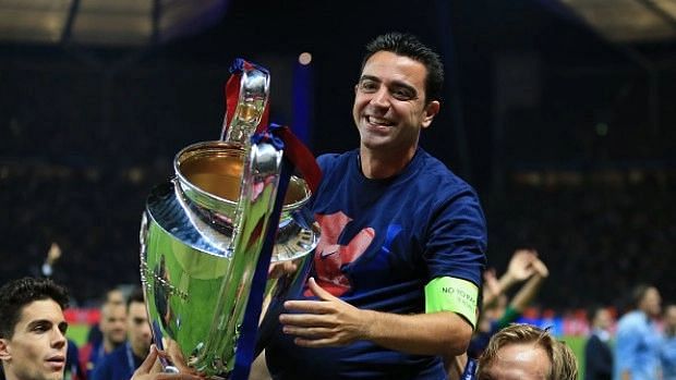 <div class="paragraphs"><p>Xavi with the UEFA Champions League trophy.</p></div>