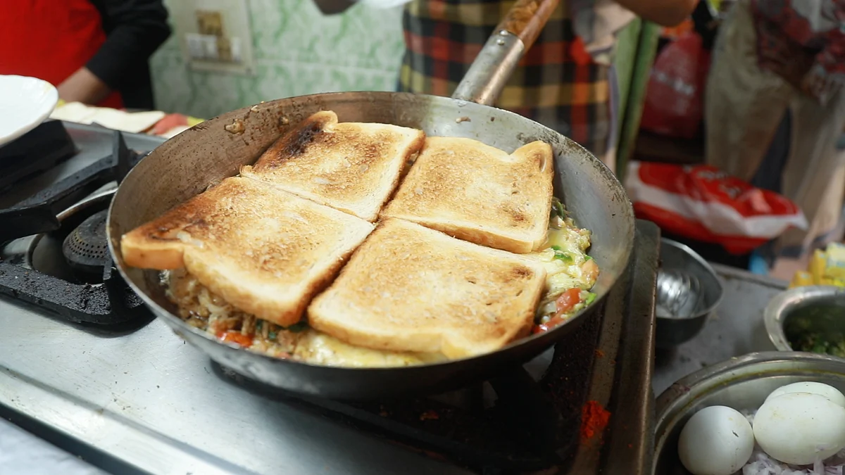 <div class="paragraphs"><p>Toasted bread over half-fry omelette.</p></div>
