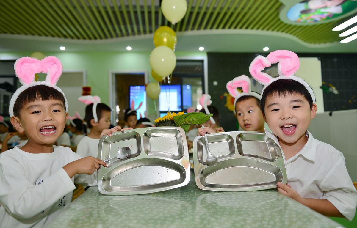 <div class="paragraphs"><p>September 29, 2020: Kids display their empty plates after finishing their meal at the Shuanggang kindergarten in Hefei City, Anhui Province. The “Clean Your Plate” campaign has been widely promoted and accepted in China to reduce food waste.  </p></div>