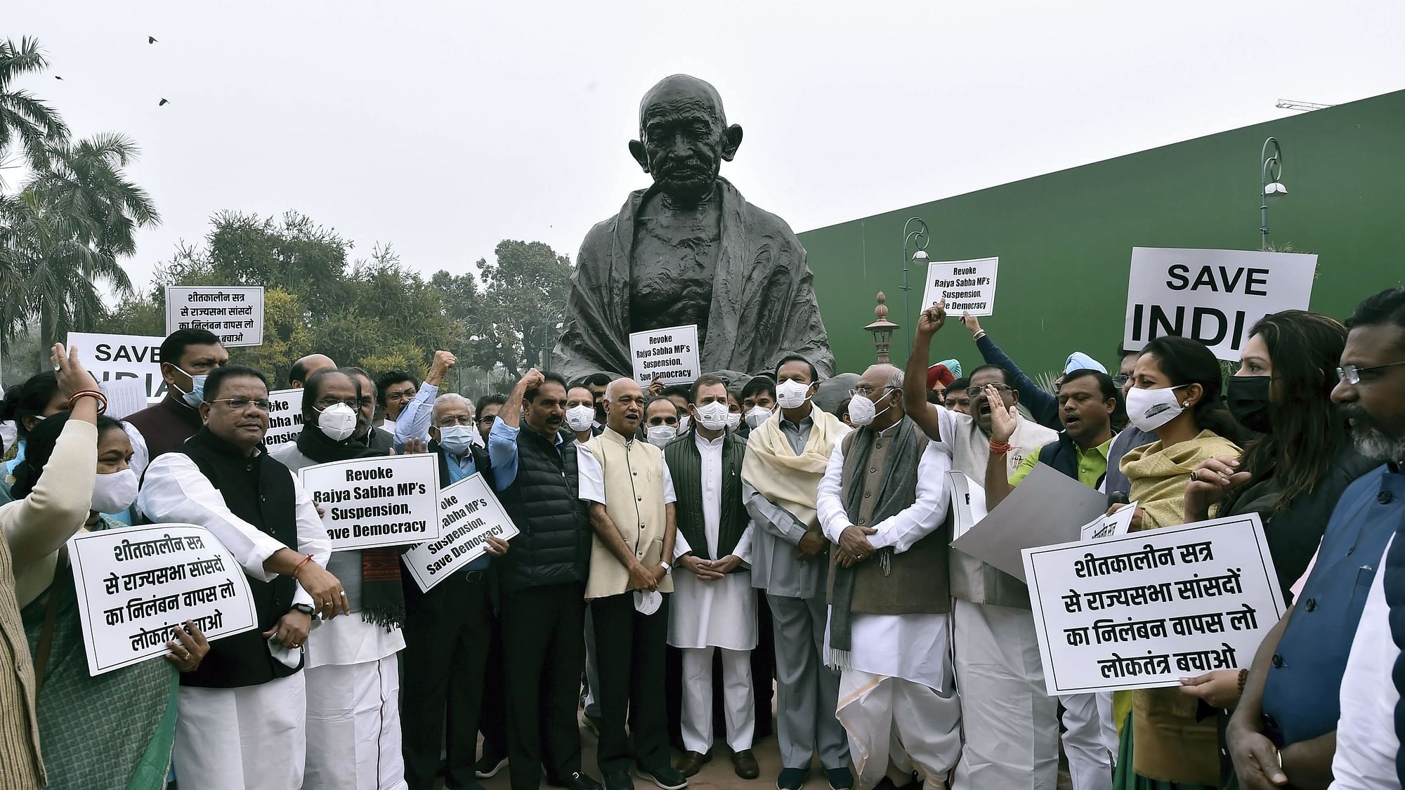 <div class="paragraphs"><p>Opposition members protest outside Parliament after the suspension of 12 Rajya Sabha MPs.</p></div>