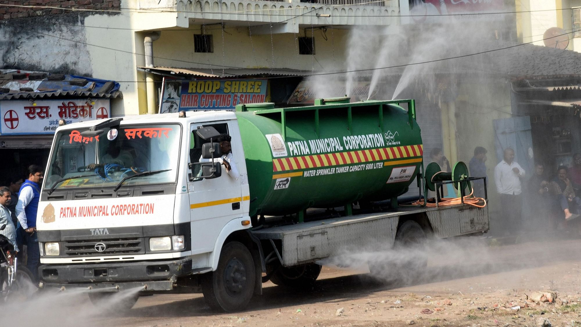 <div class="paragraphs"><p>Patna: Patna Municipal Corporation workers spray disinfectant in a residential area amid Omicron threat, the new variant of the COVID-19, in Patna, Sunday, 5 December.</p></div>